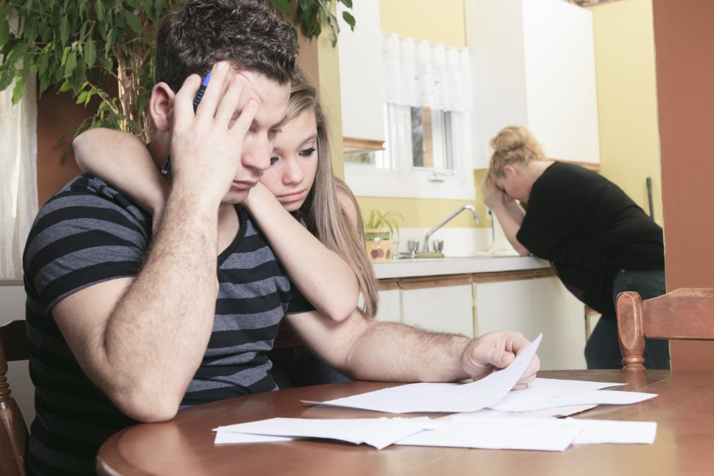 Family with financial stress and digital poverty at homeaA men with financial stress at home