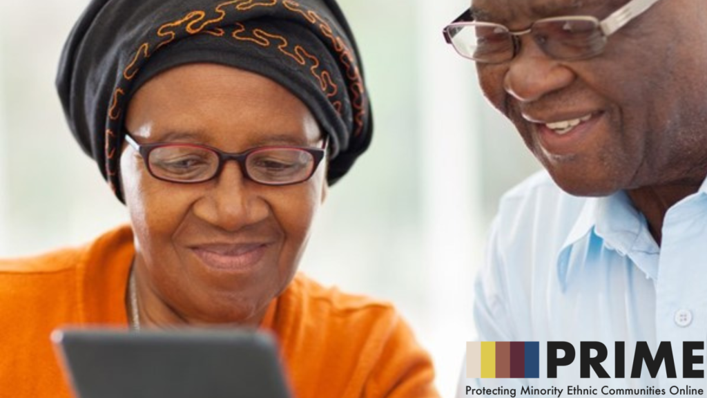 Image of two older black adults using a tablet.
