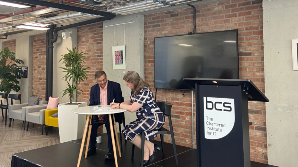 BCS MOU signing event with an audience of people